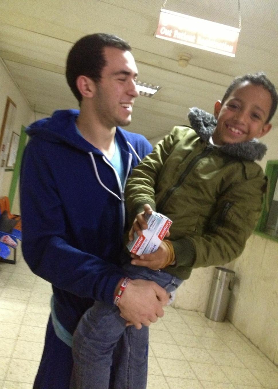 Chapel Hill shooting victim seen helping young Palestinian refugees in newly surfaced videoimage