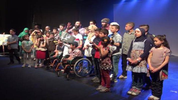 Children provide a silent play about their experience with pain in Syriaimage