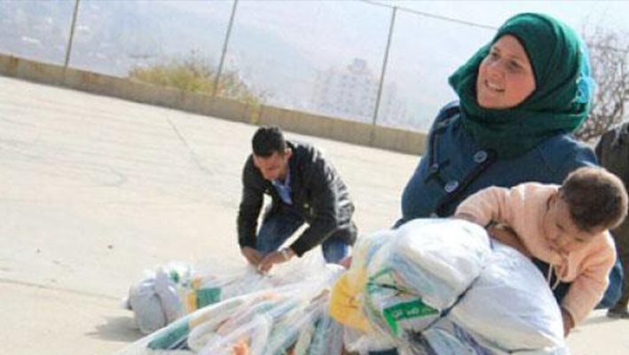 Saudi Arabia distributes winter clothing to Syrians in Lebanonimage